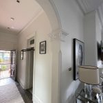 Detailed archway and hallway repaint in Drummoyne showing smooth wall finish and heritage detailing
