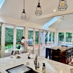 Bright kitchen and dining area repaint in Drummoyne with white walls and large windows
