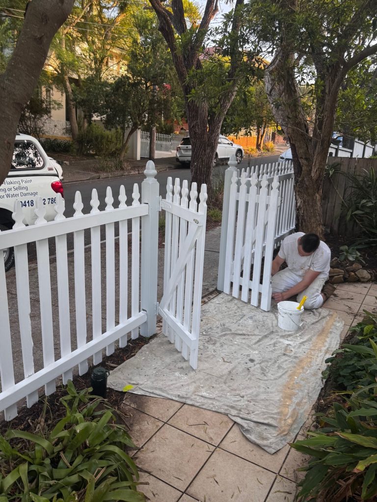 Detail painting of timber gate and fence in Marrickville