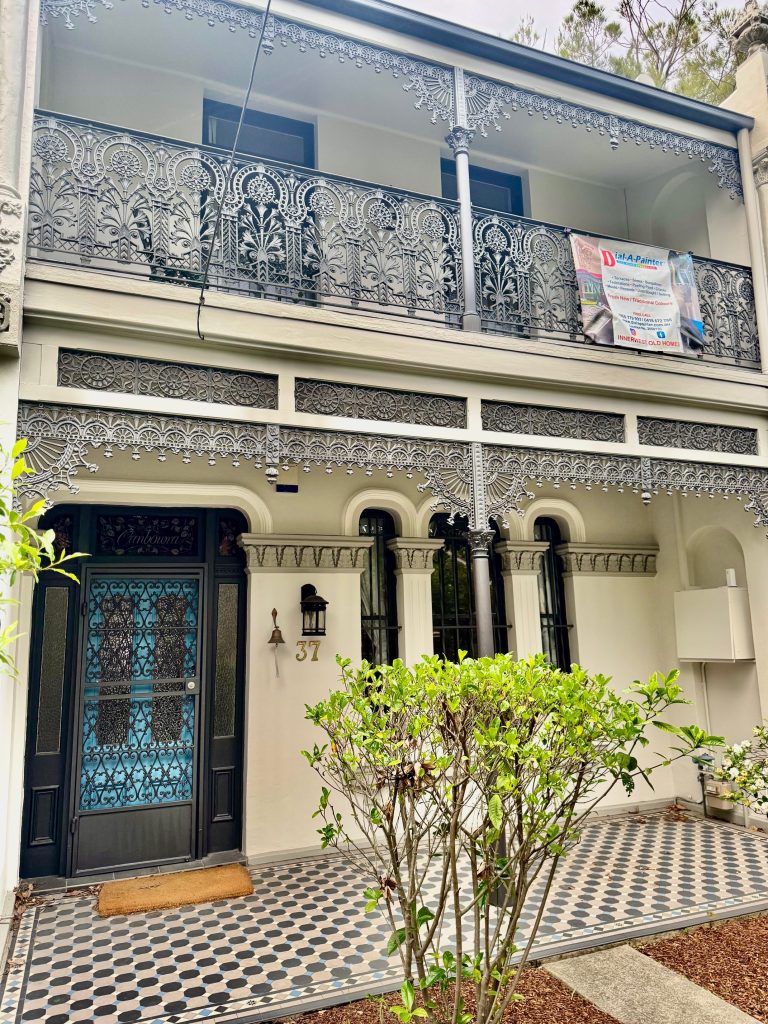 Heritage house facade repaint in Petersham with ornate balcony detail