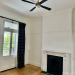Living room repaint in Petersham with heritage fireplace and ceiling rose