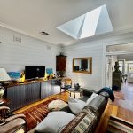 Interior living room painting in Annandale character home with timber wall panelling
