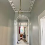 Interior hallway during preparation stage with surfaces patched and ready for painting