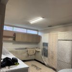Kitchen preparation and protection work before interior repainting project in Five Dock NSW
