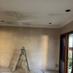 Interior living room preparation with wall crack repairs and ceiling restoration before painting in Five Dock NSW