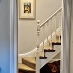 Interior staircase painting with white balustrades and timber details in Enmore home