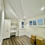Bedroom interior in Ashbury home with vaulted ceiling, custom joinery and detailed painting finishes