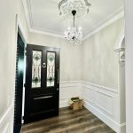 Entry hall in Ashbury home featuring decorative ceilings, stained glass front door and painted wall details