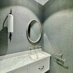 Powder room in Ashbury home with decorative wall finish, custom vanity and detailed interior painting