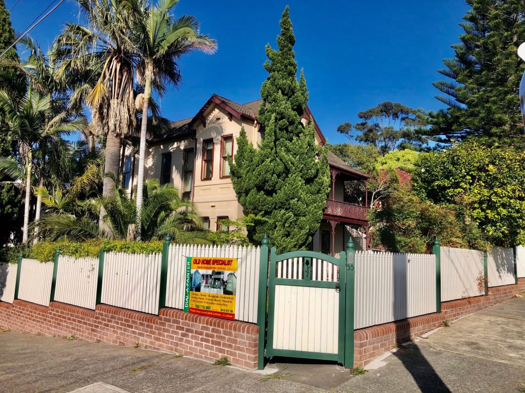 Exterior painting of heritage house in Douglas Street Stanmore with traditional colour scheme
