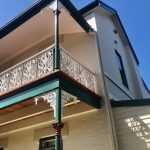 Upper level exterior painting of heritage home in Stanmore with ornate balcony