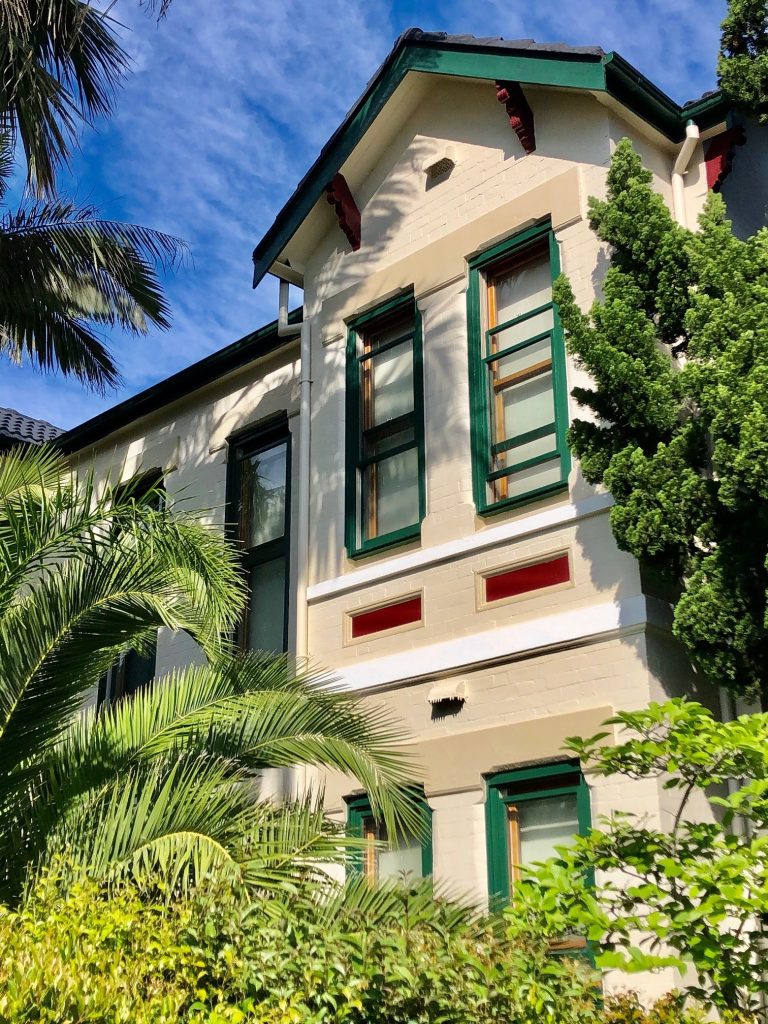 Heritage house exterior detail on Douglas Street Stanmore with decorative timber and brickwork