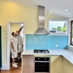 Painters completing kitchen painting work in heritage home at Summer Hill NSW