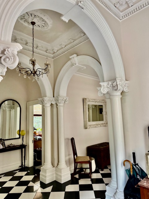 Victorian heritage interior with ornate arches, columns and decorative plasterwork